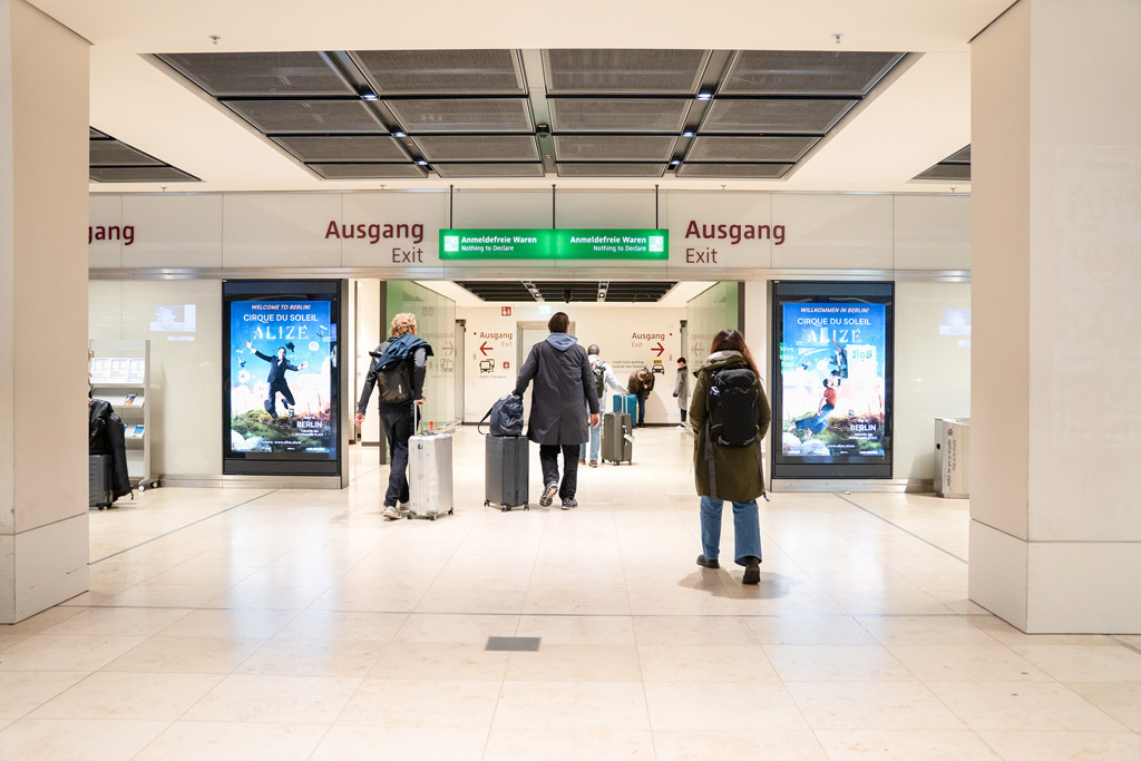 Poster display case baggage claim area